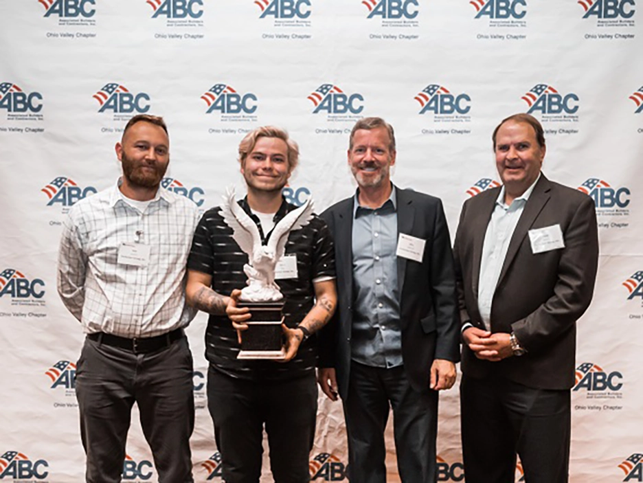 Perfection team accepting the Eagle award