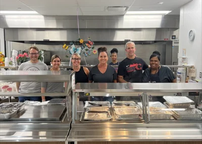 Group of Perfection team volunteering at Bethany's House