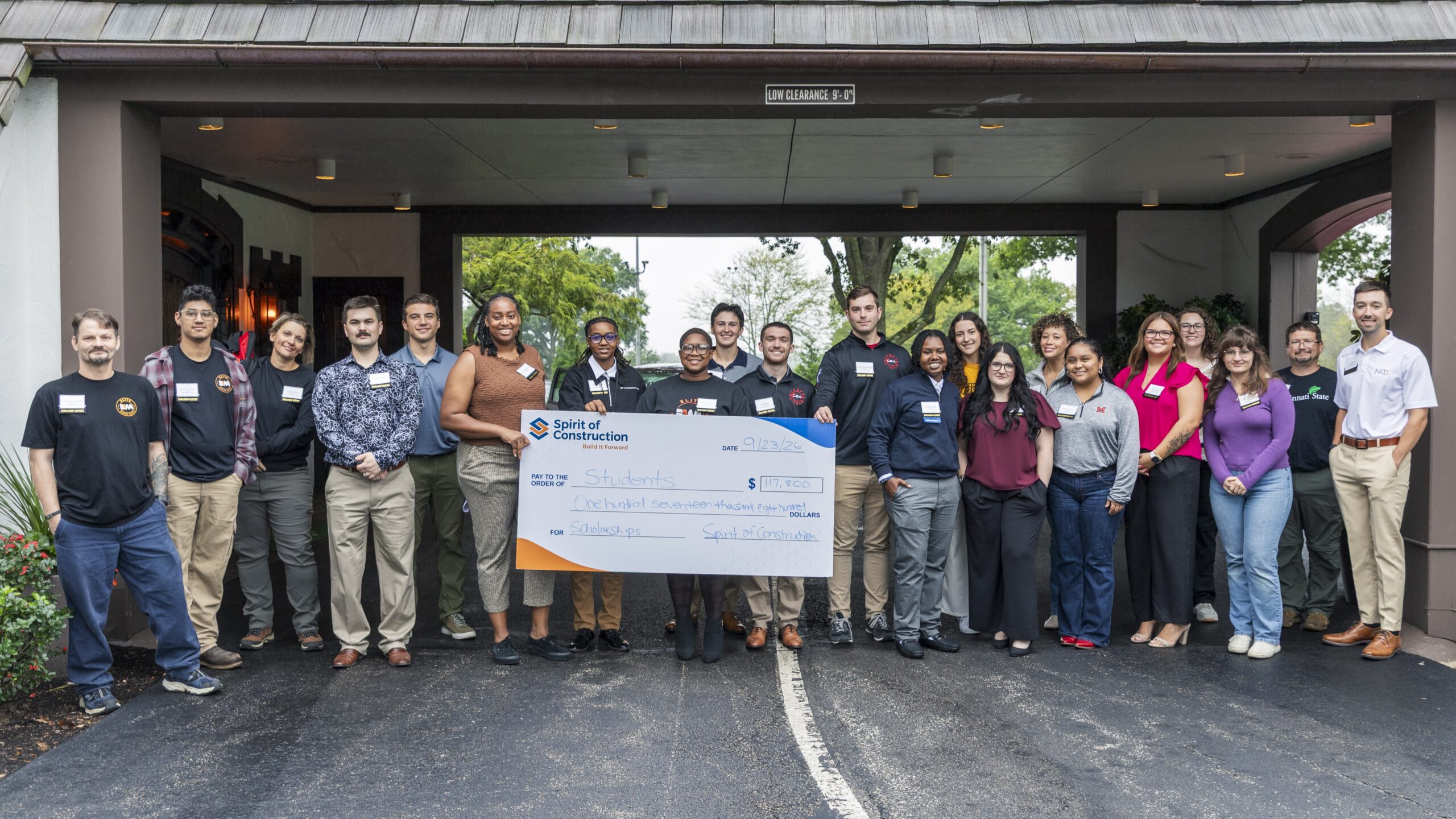 2026 Spirit of Construction Foundation scholarship recipients hold a ceremonial check at the scholarship breakfast co-hosted by Perfection Group at Kenwood Country Club